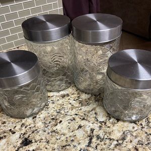 Set of 4 glass rooster canisters stainless lids